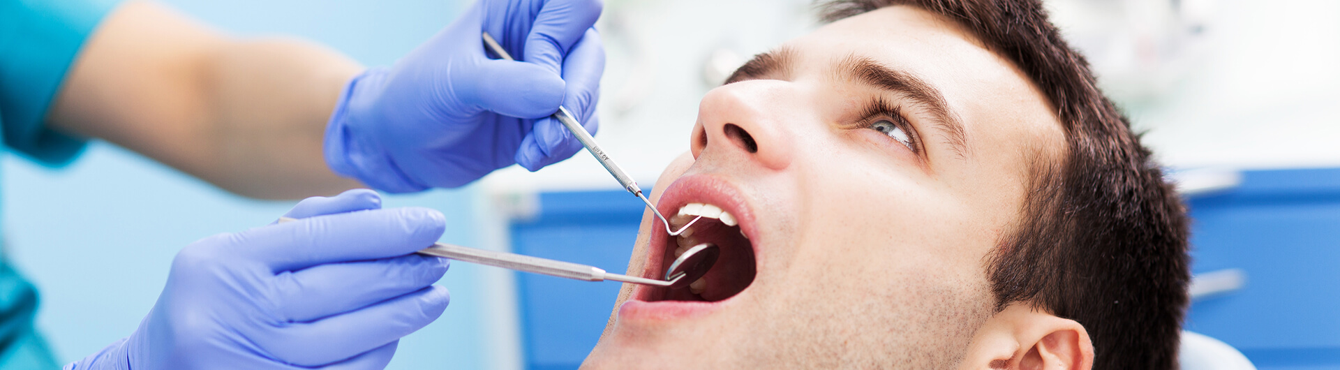 man receiving a dental cleaning