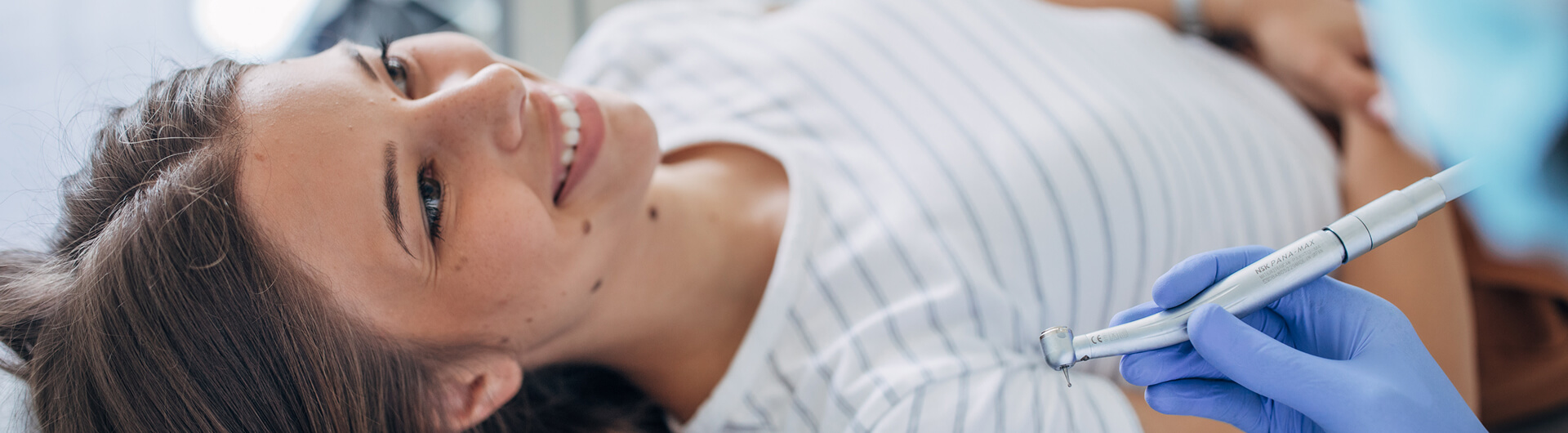woman laying back for dental treatment
