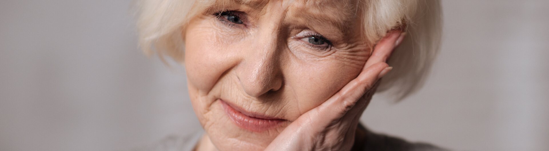 older woman with jaw pain