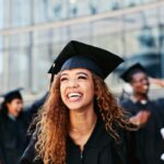 woman smiling at graduation, graduation photos, cosmetic dentistry to improve smile