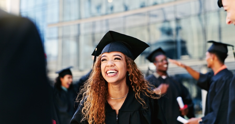 woman smiling at graduation, graduation photos, cosmetic dentistry to improve smile